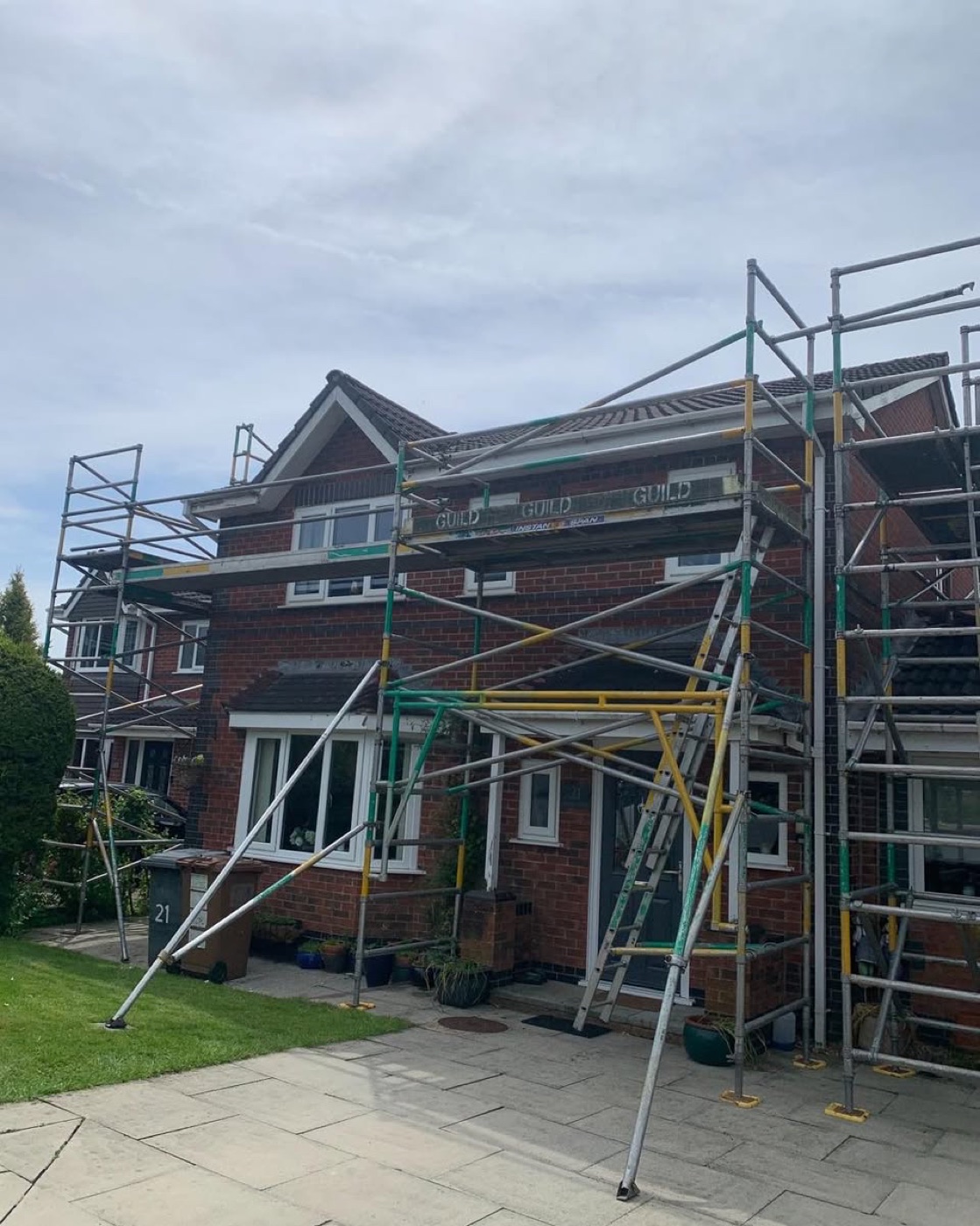 Full residential scaffold wrap with Guild-branded boards