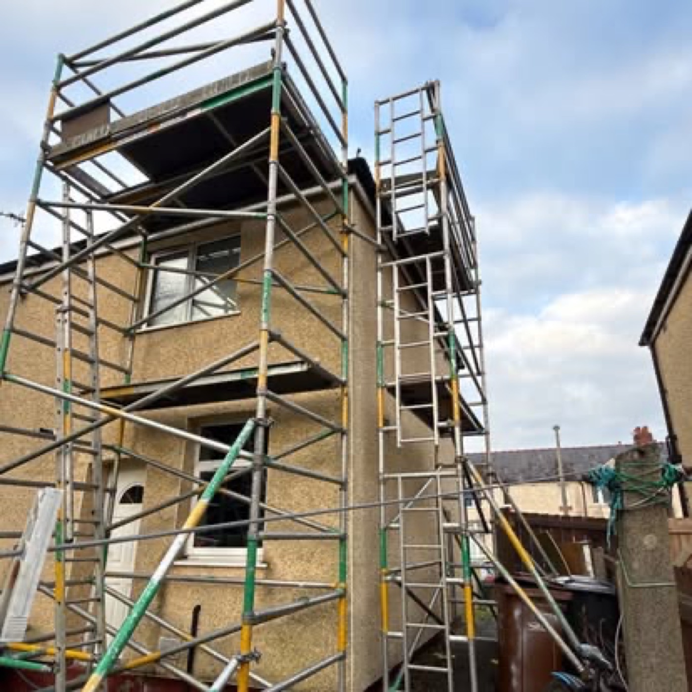 System scaffold full wrap on a pebbledash house